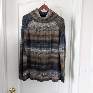 Multi-colored turtleneck sweater, size L.